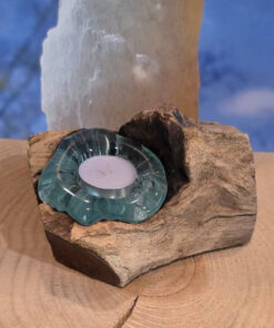 Molten glass tea candle holder on wood